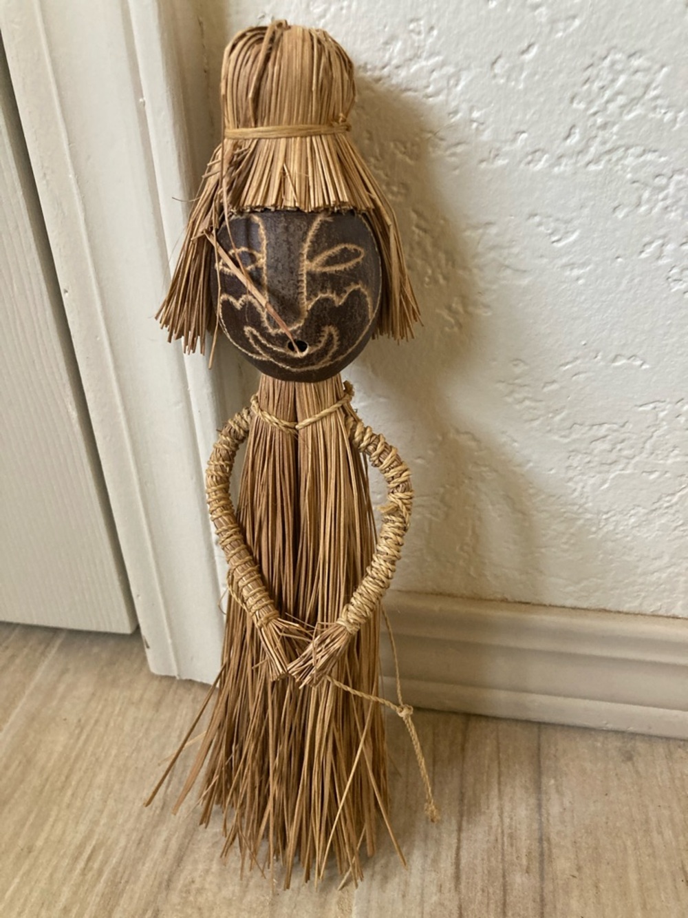Handcrafted Straw Doll with Carved Dark Face